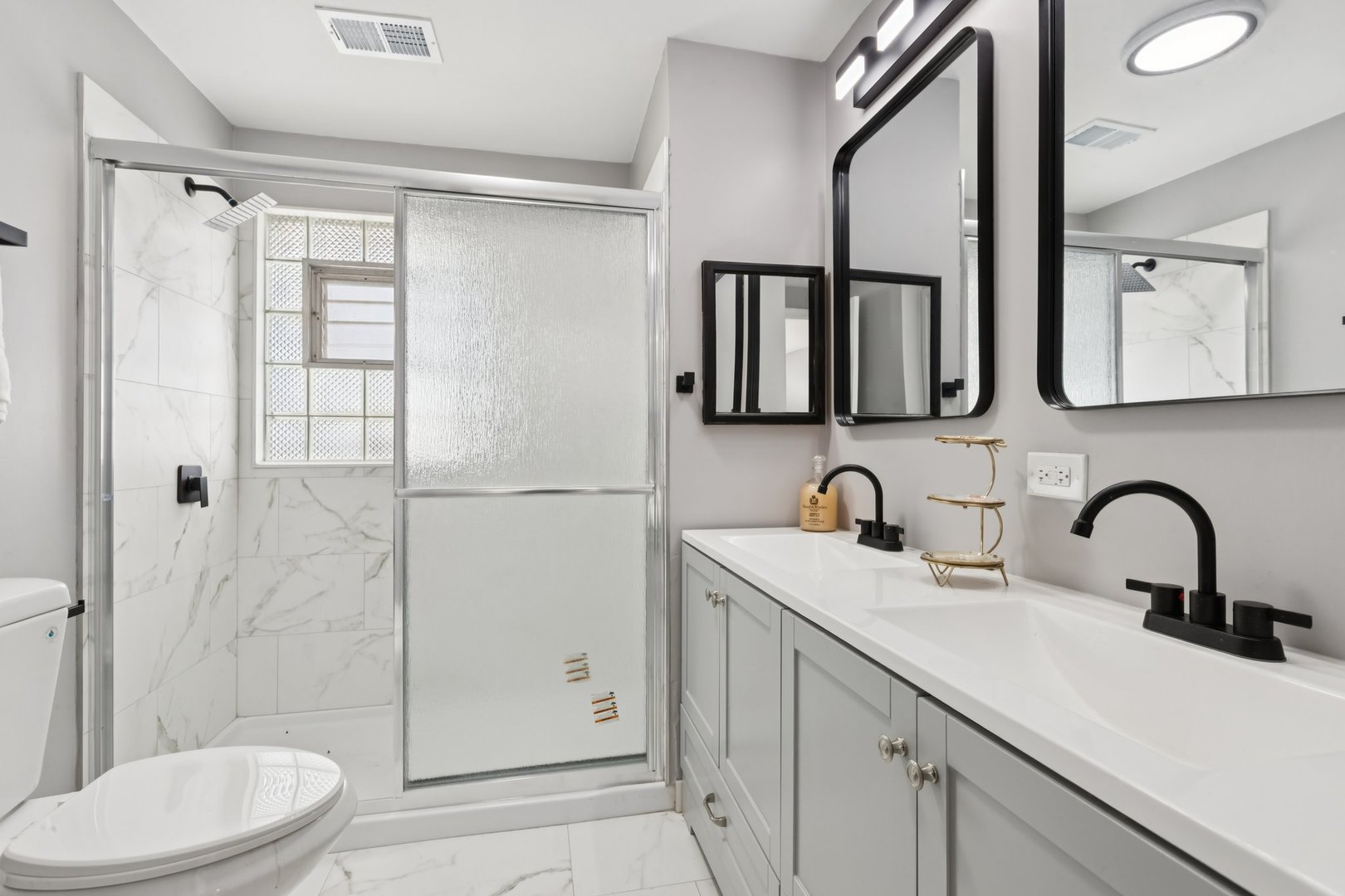 4N327 7th Avenue Addison, IL 60101 - Photo 37 of 49 a bathroom with a sink a toilet and shower