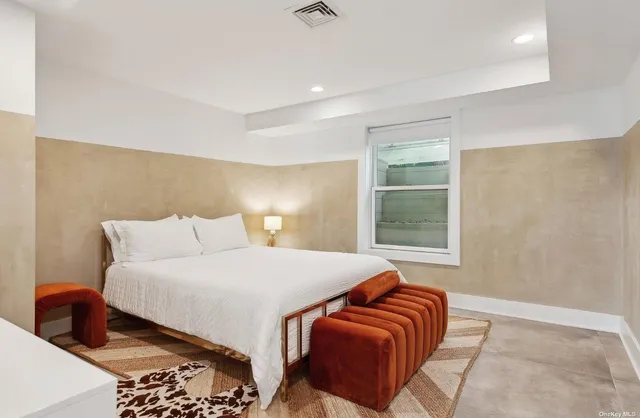 a view of patio with table and chairs and potted plants