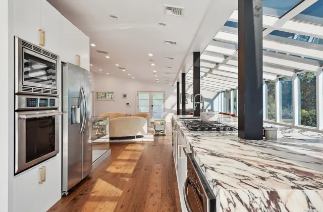 a living room with a bed furniture and a fireplace