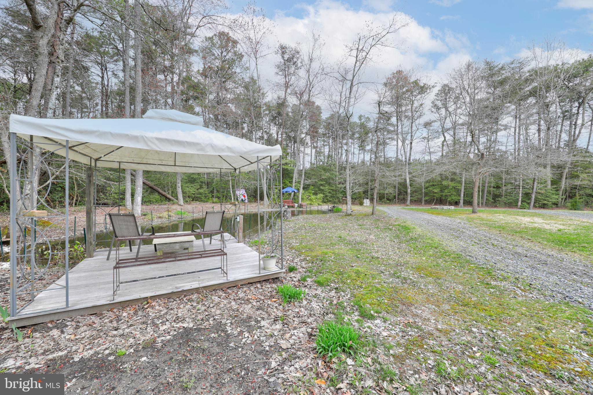 22371 Deep Branch Road Georgetown, DE 19947 - Photo 73 of 78 Gazebo and deck overlooking the pond