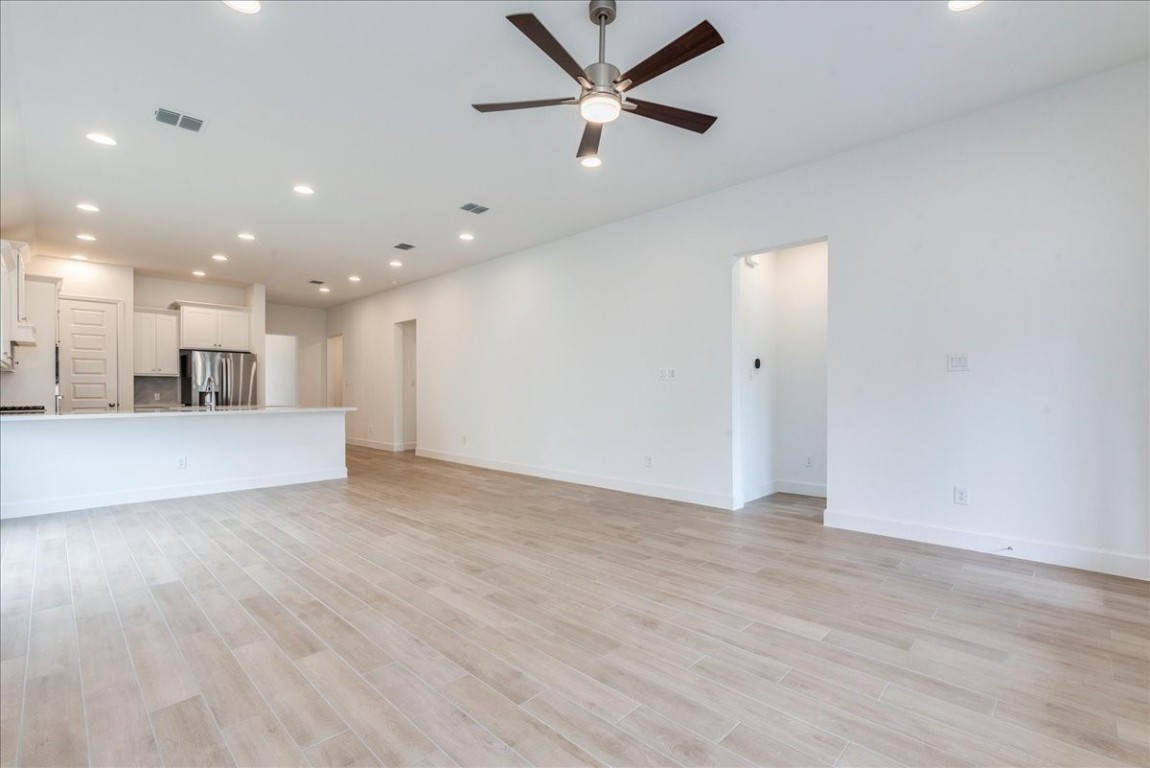 164 Kimble Creek Loop Kyle, TX 78640 - Photo 11 of 35 a view of a kitchen with a sink and a window