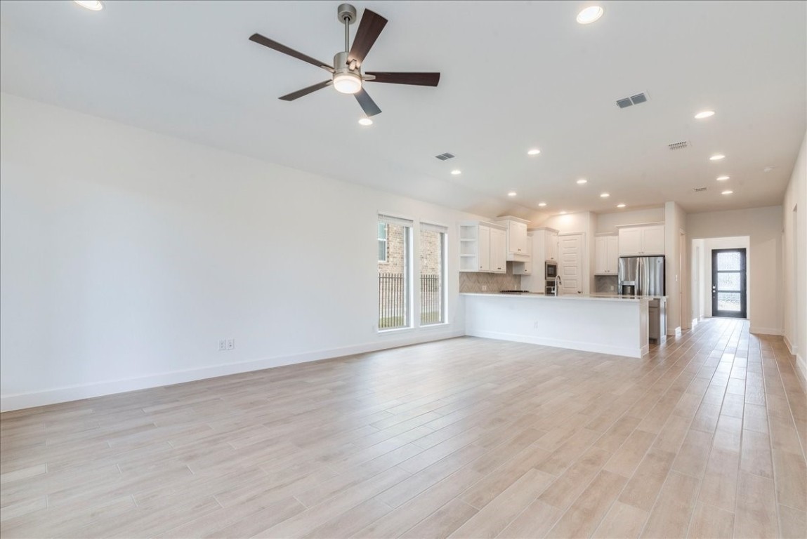 164 Kimble Creek Loop Kyle, TX 78640 - Photo 12 of 35 a view of a kitchen with a sink and a stove top oven