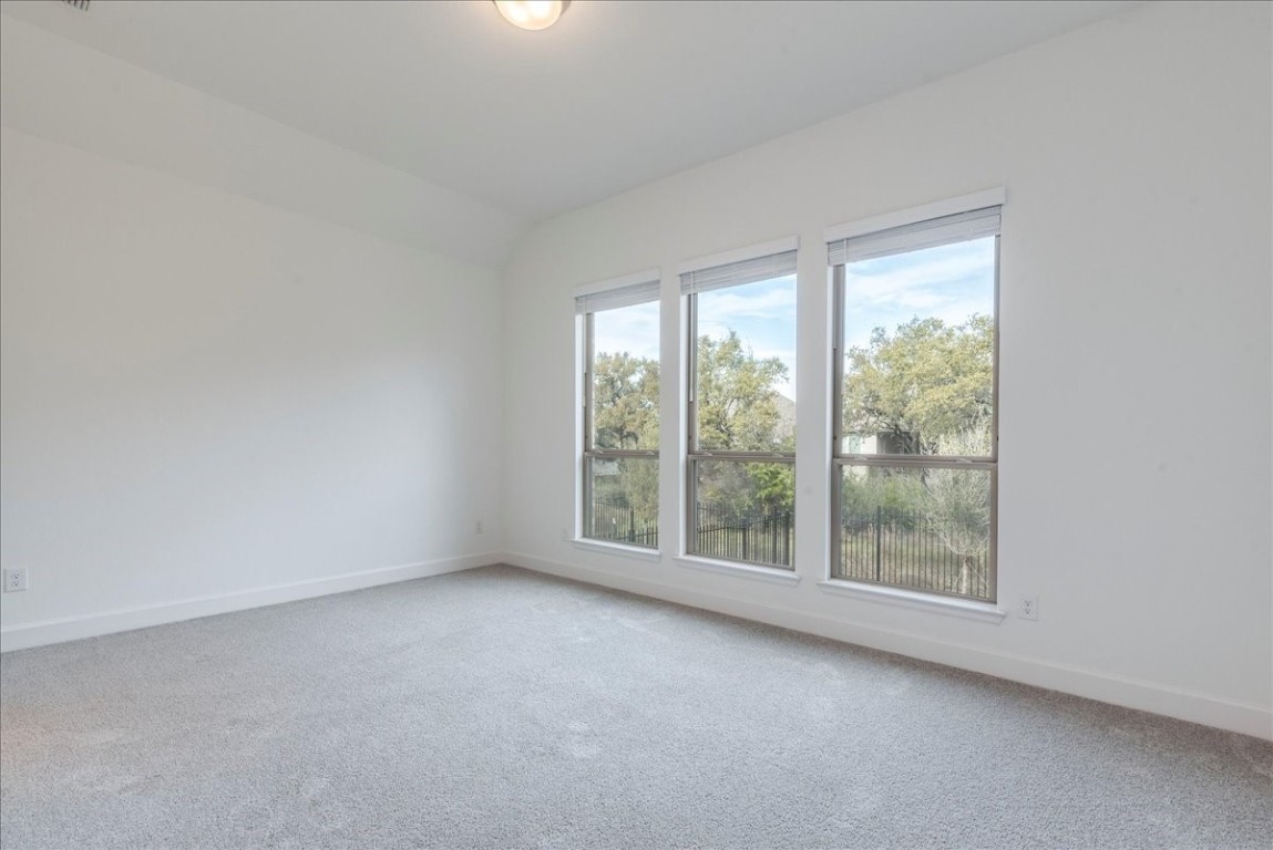 164 Kimble Creek Loop Kyle, TX 78640 - Photo 13 of 35 an empty room with windows