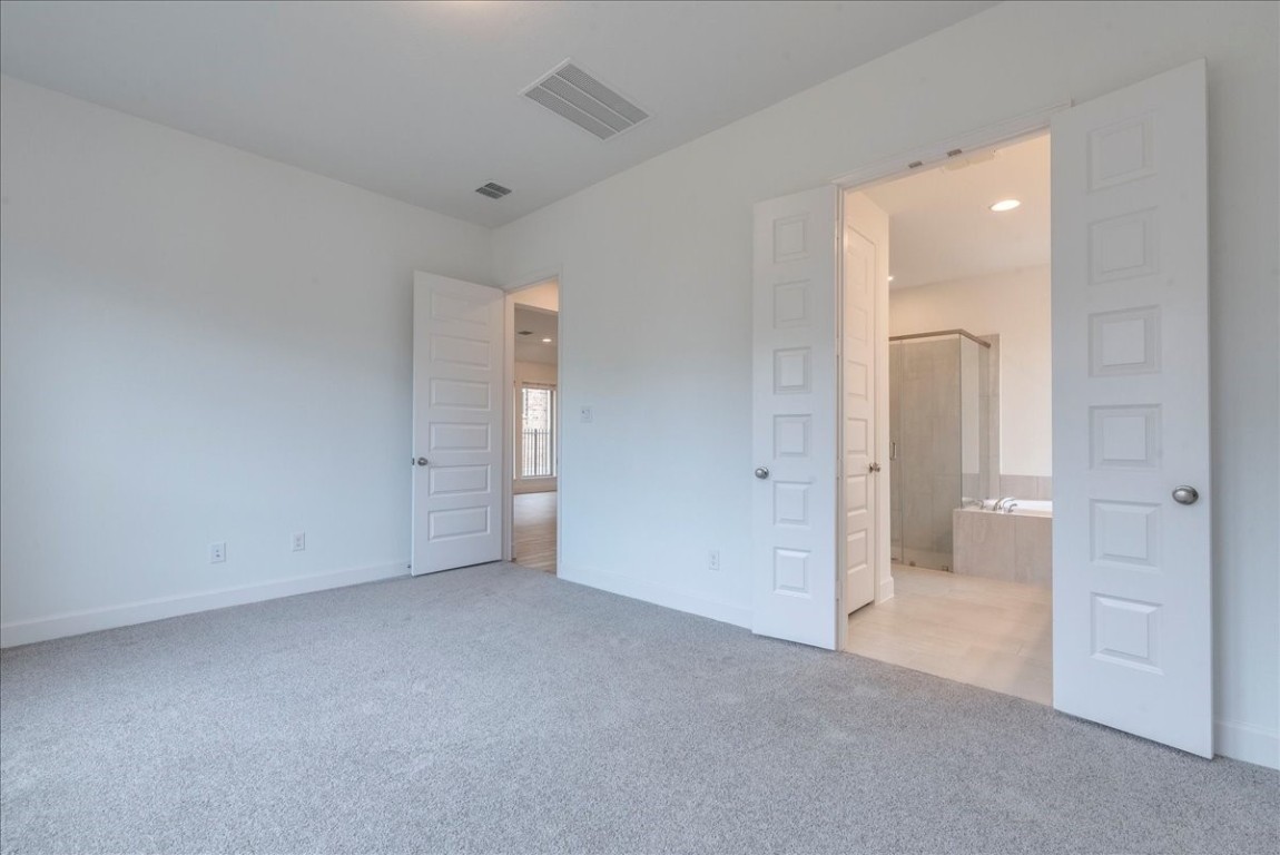 164 Kimble Creek Loop Kyle, TX 78640 - Photo 14 of 35 an empty room with a bathroom and a sink