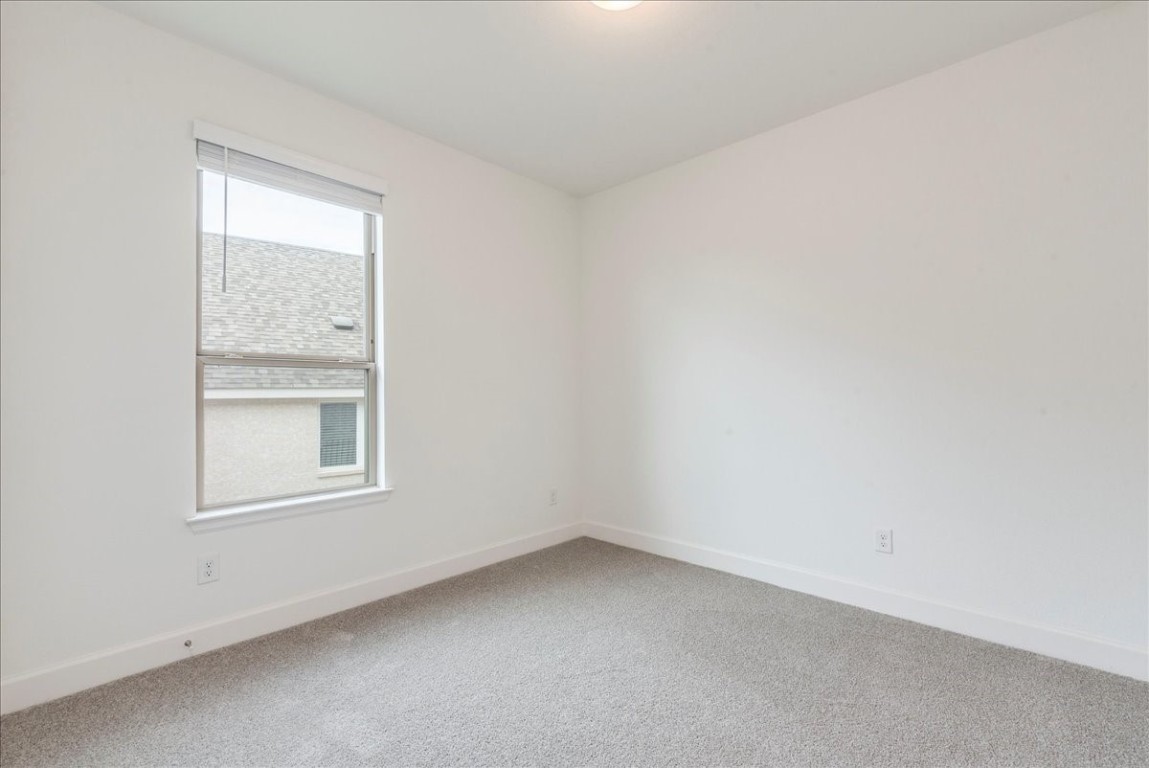 164 Kimble Creek Loop Kyle, TX 78640 - Photo 20 of 35 an empty room with a window