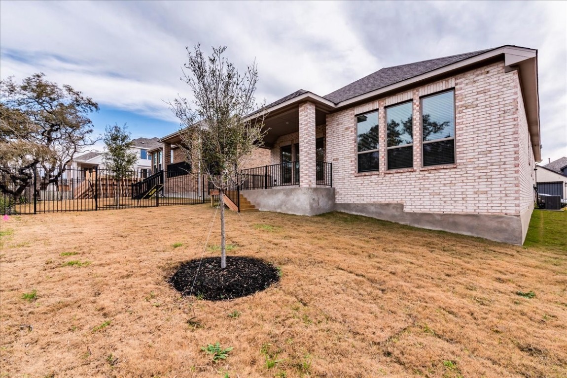 164 Kimble Creek Loop Kyle, TX 78640 - Photo 28 of 35 a front view of house with yard