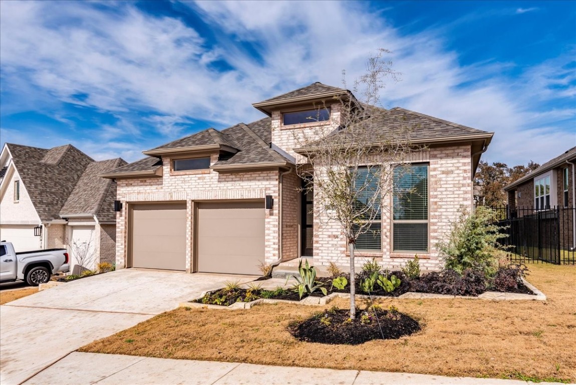 164 Kimble Creek Loop Kyle, TX 78640 - Photo 3 of 35 a front view of a house with a yard