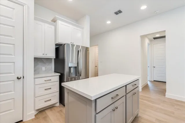 a kitchen with a refrigerator a sink and dishwasher