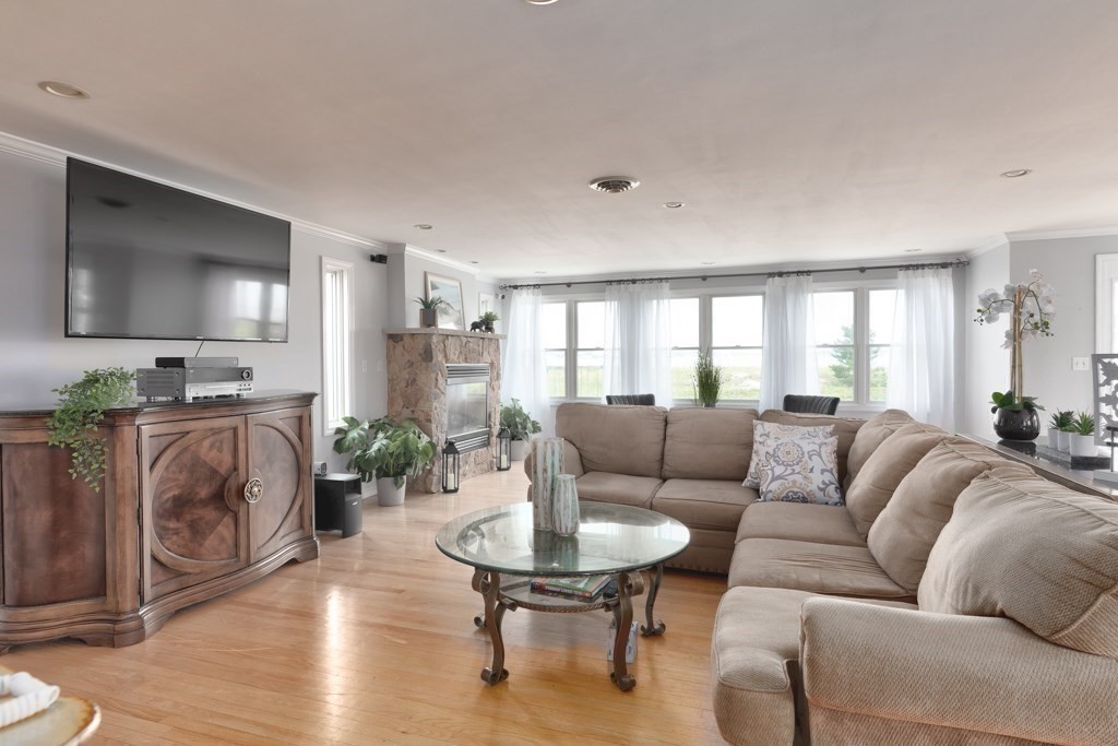 175 Rice Avenue Revere, MA 02151 - Photo 11 of 30 a living room with furniture and a fireplace