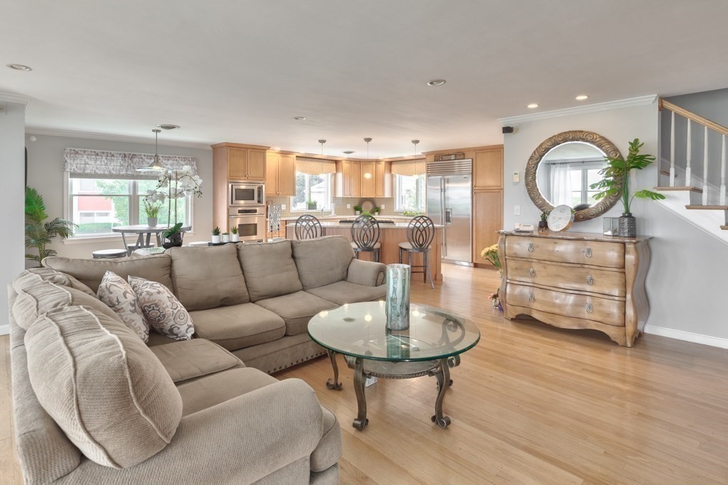 175 Rice Avenue Revere, MA 02151 - Photo 13 of 30 a living room with furniture a fireplace and a large window