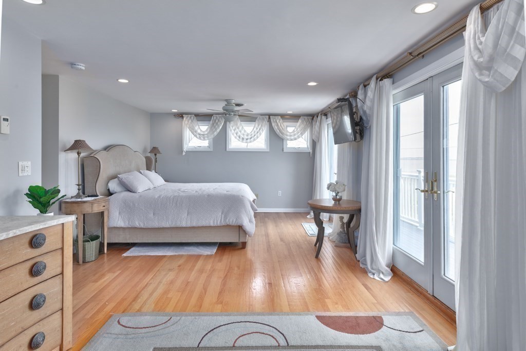 175 Rice Avenue Revere, MA 02151 - Photo 18 of 30 a bedroom with furniture and a wooden floor