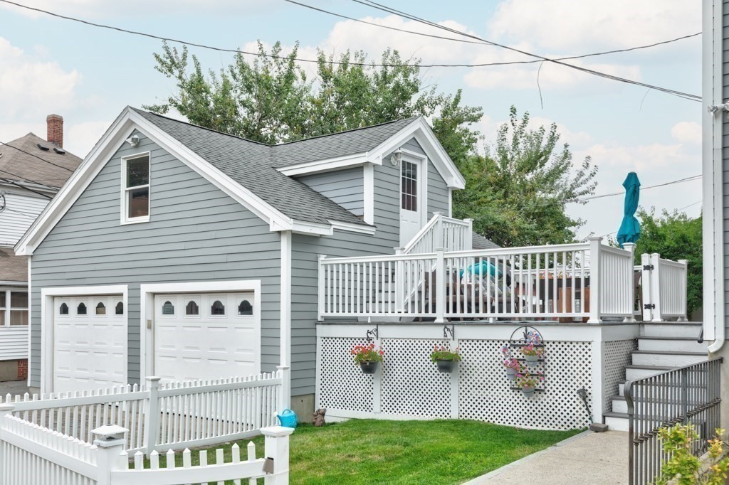 175 Rice Avenue Revere, MA 02151 - Photo 6 of 30 a view of a house with a small yard and wooden fence