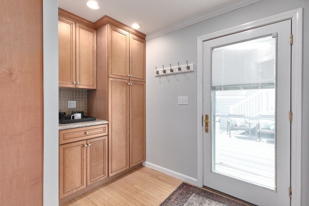 175 Rice Avenue Revere, MA 02151 - Photo 10 of 30 a view of a kitchen with wooden floor and cabinets