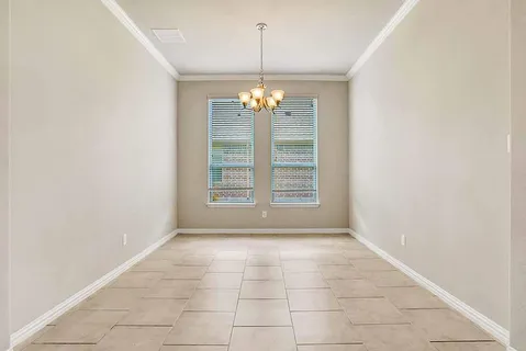 en view interior of a house with stairs and chandelier