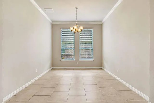 en view interior of a house with stairs and chandelier