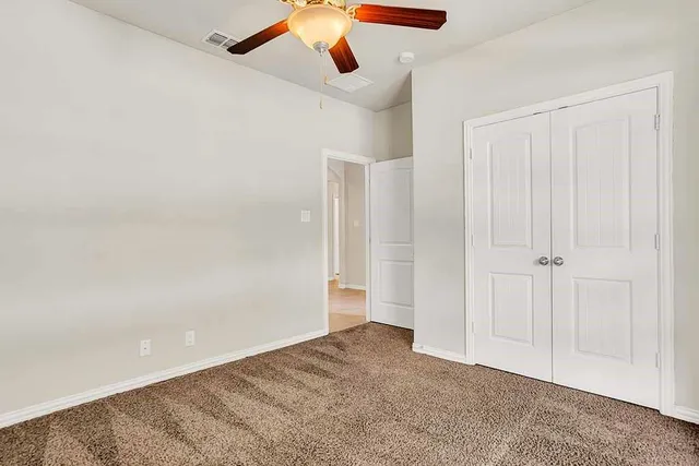 a bathroom with a bathtub shower sink and mirror