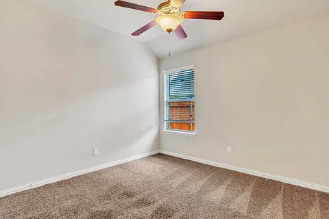 an empty room with fan
