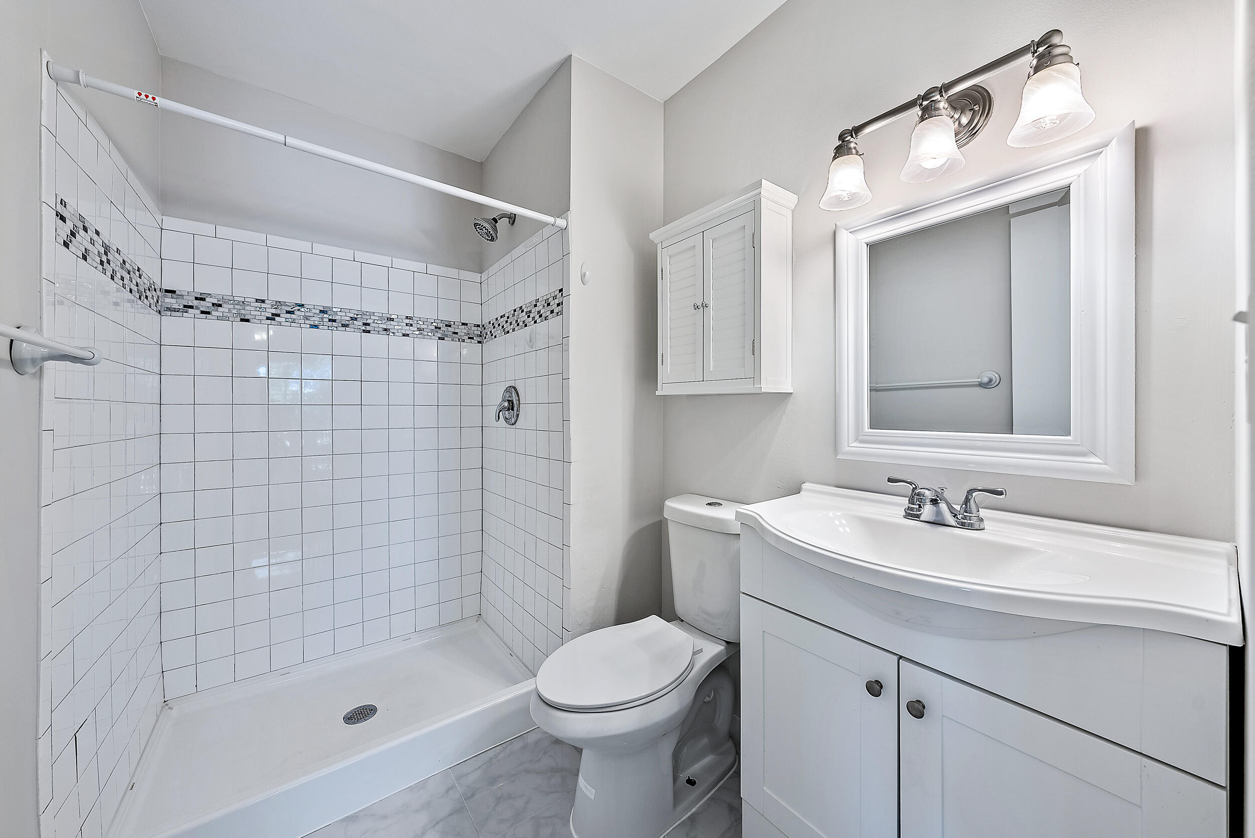 6559 Chasewood Drive, Unit E Jupiter, FL 33458 - Photo 15 of 26 Primary Bathroom