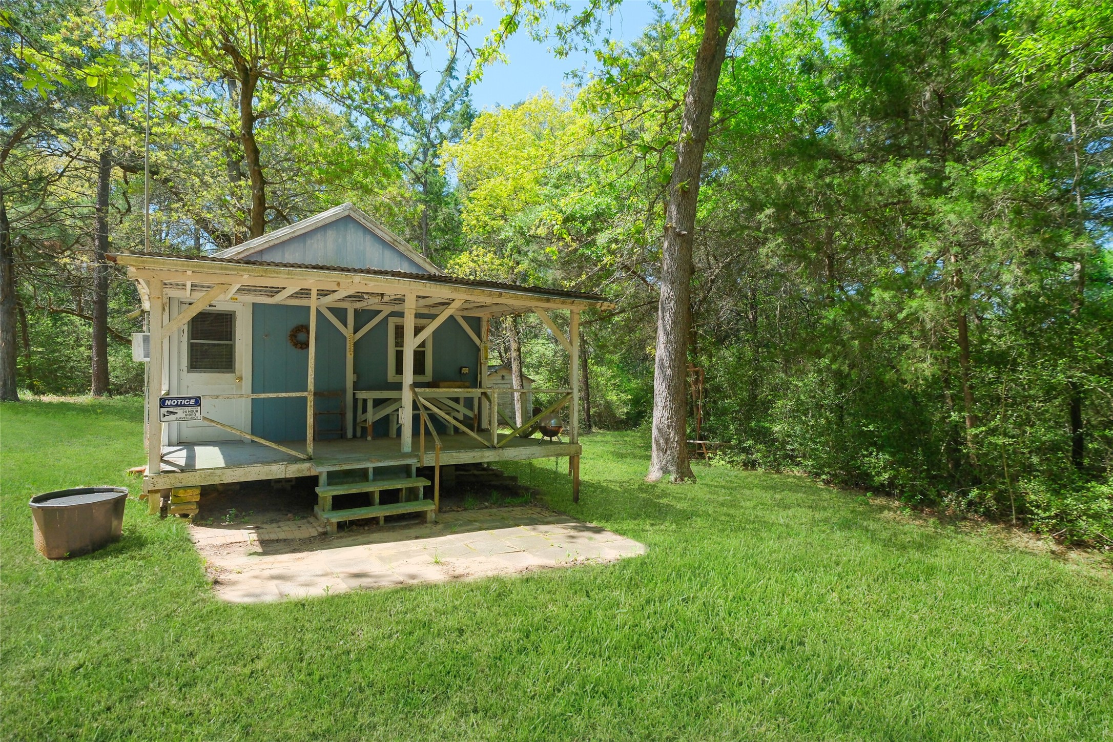 24718 Squirrel Road New Ulm, TX 78950 - Photo 16 of 26 a view of a house with backyard porch and sitting area