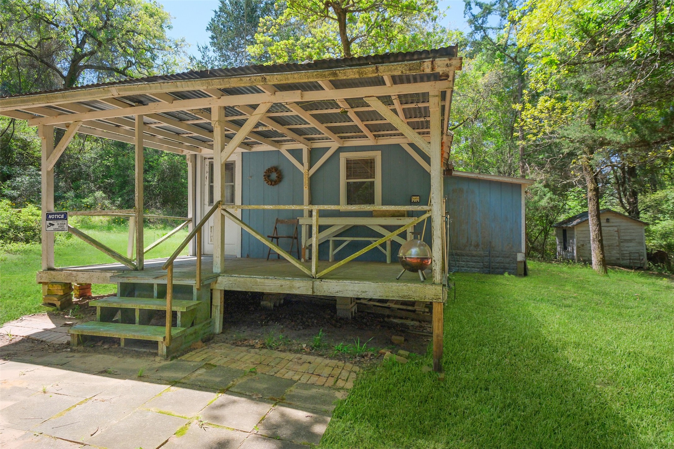 24718 Squirrel Road New Ulm, TX 78950 - Photo 17 of 26 an outdoor space with wooden roof and deck
