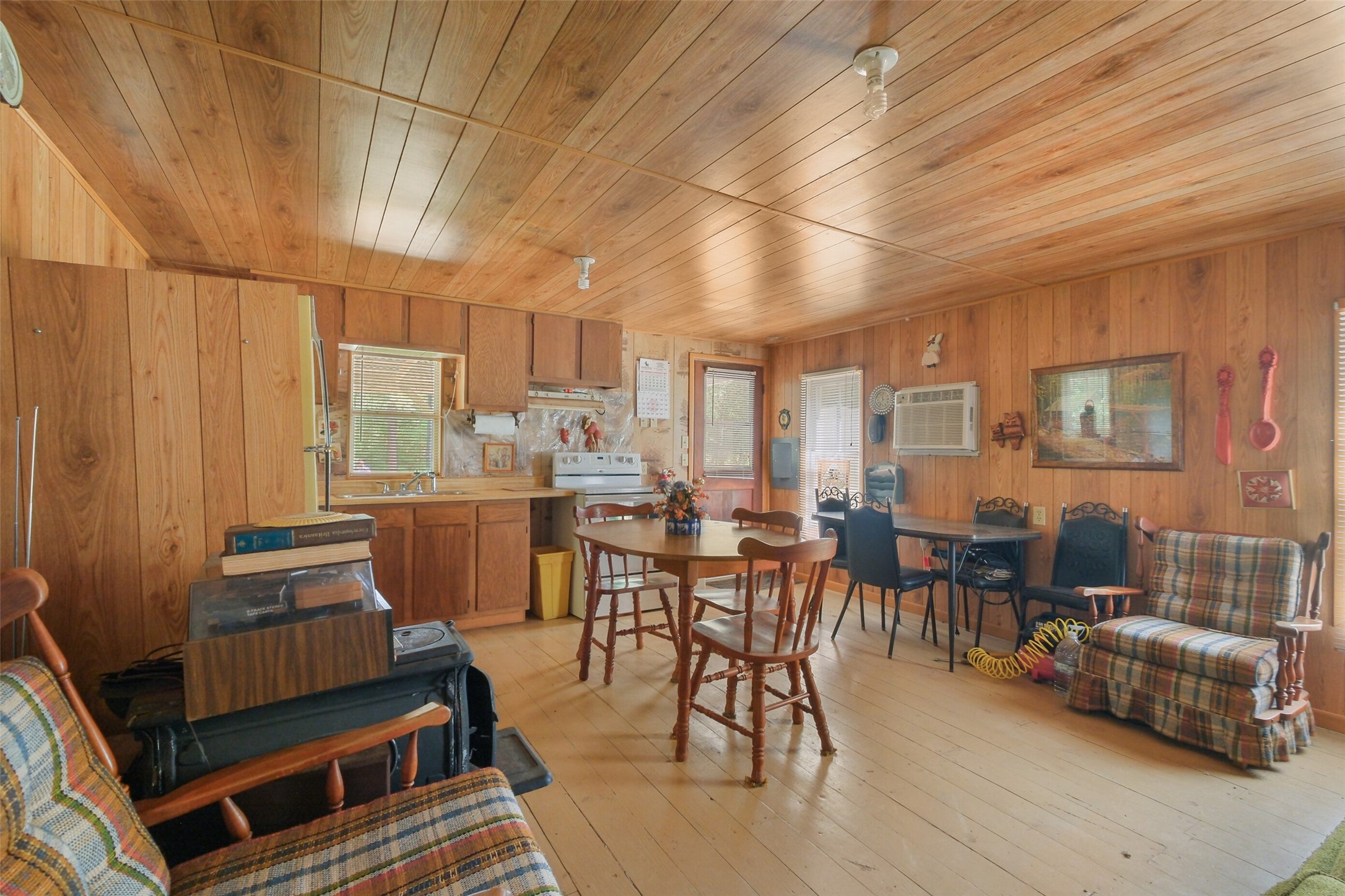24718 Squirrel Road New Ulm, TX 78950 - Photo 19 of 26 a dining room with wooden floor and furniture
