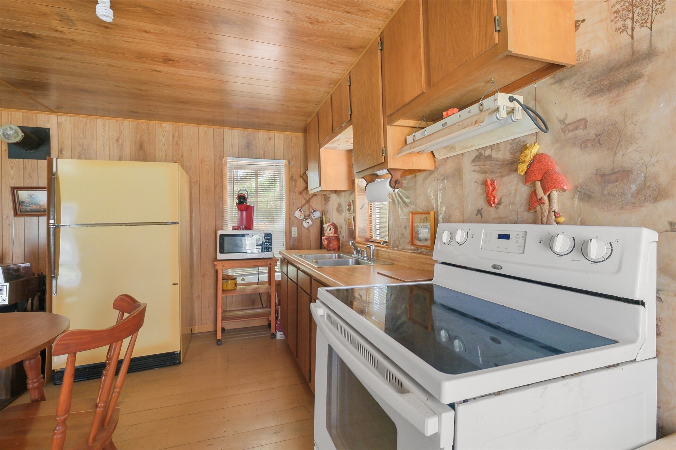 24718 Squirrel Road New Ulm, TX 78950 - Photo 20 of 26 a kitchen with a sink appliances and cabinets