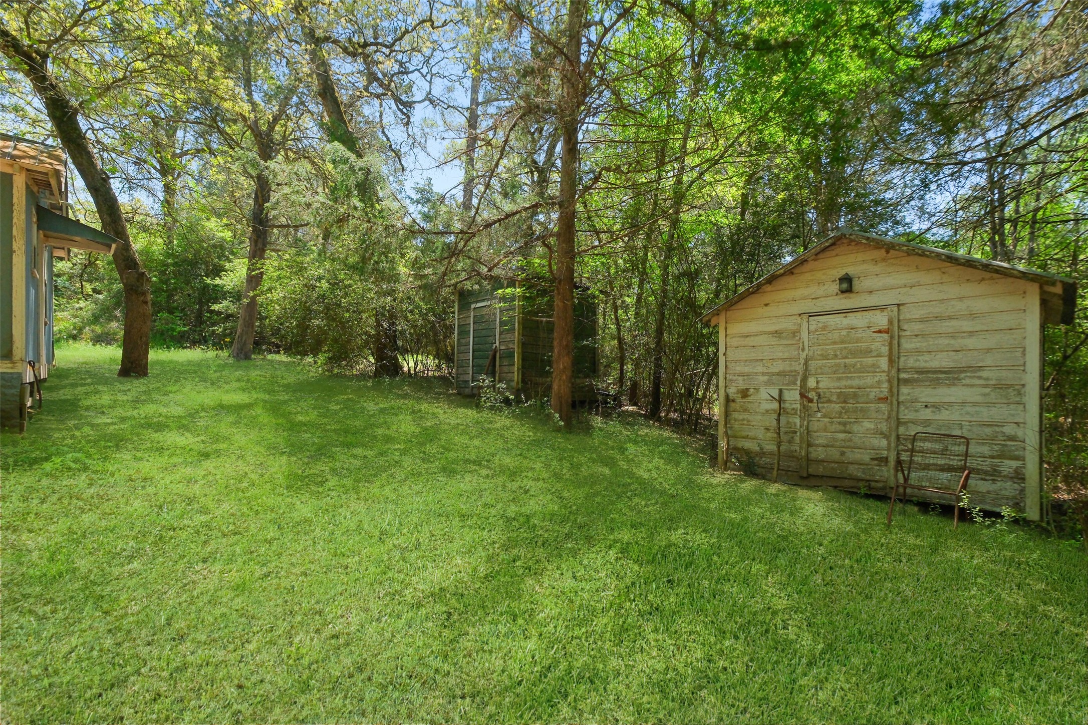 24718 Squirrel Road New Ulm, TX 78950 - Photo 24 of 26 a front view of a house with a yard