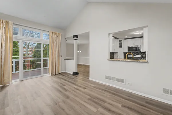 a view of an empty room with a window