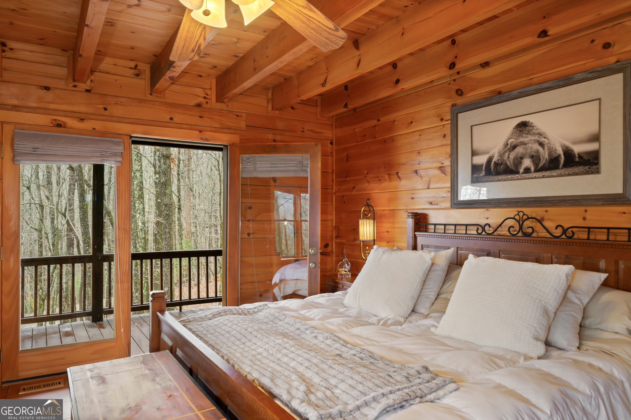 541 Little Bushy Head Road, Unit 271 Blue Ridge, GA 30513 - Photo 13 of 43 a bedroom with a bed a painting on the wall and a large window