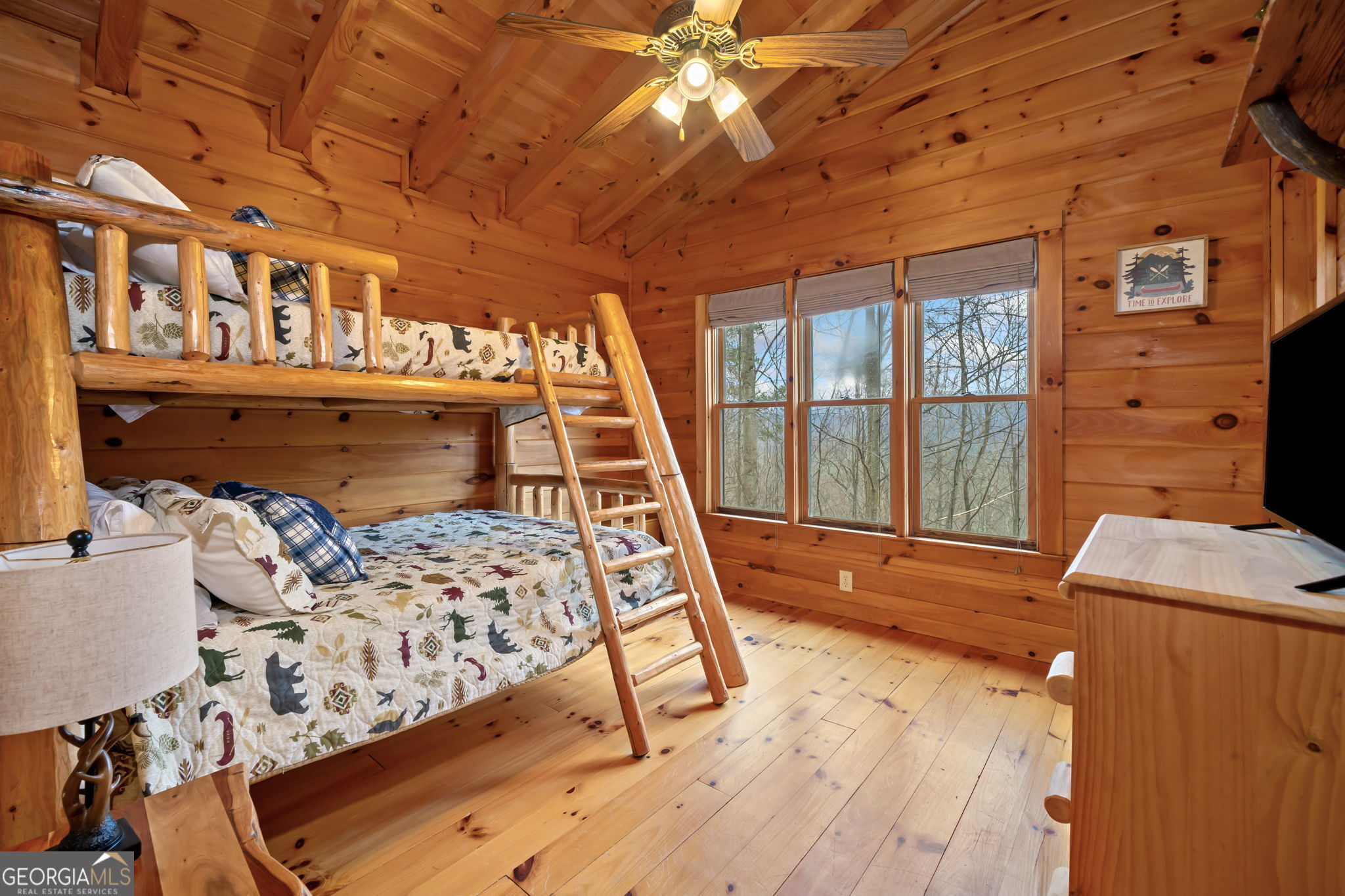 541 Little Bushy Head Road, Unit 271 Blue Ridge, GA 30513 - Photo 18 of 43 a bedroom with furniture window and flat screen tv