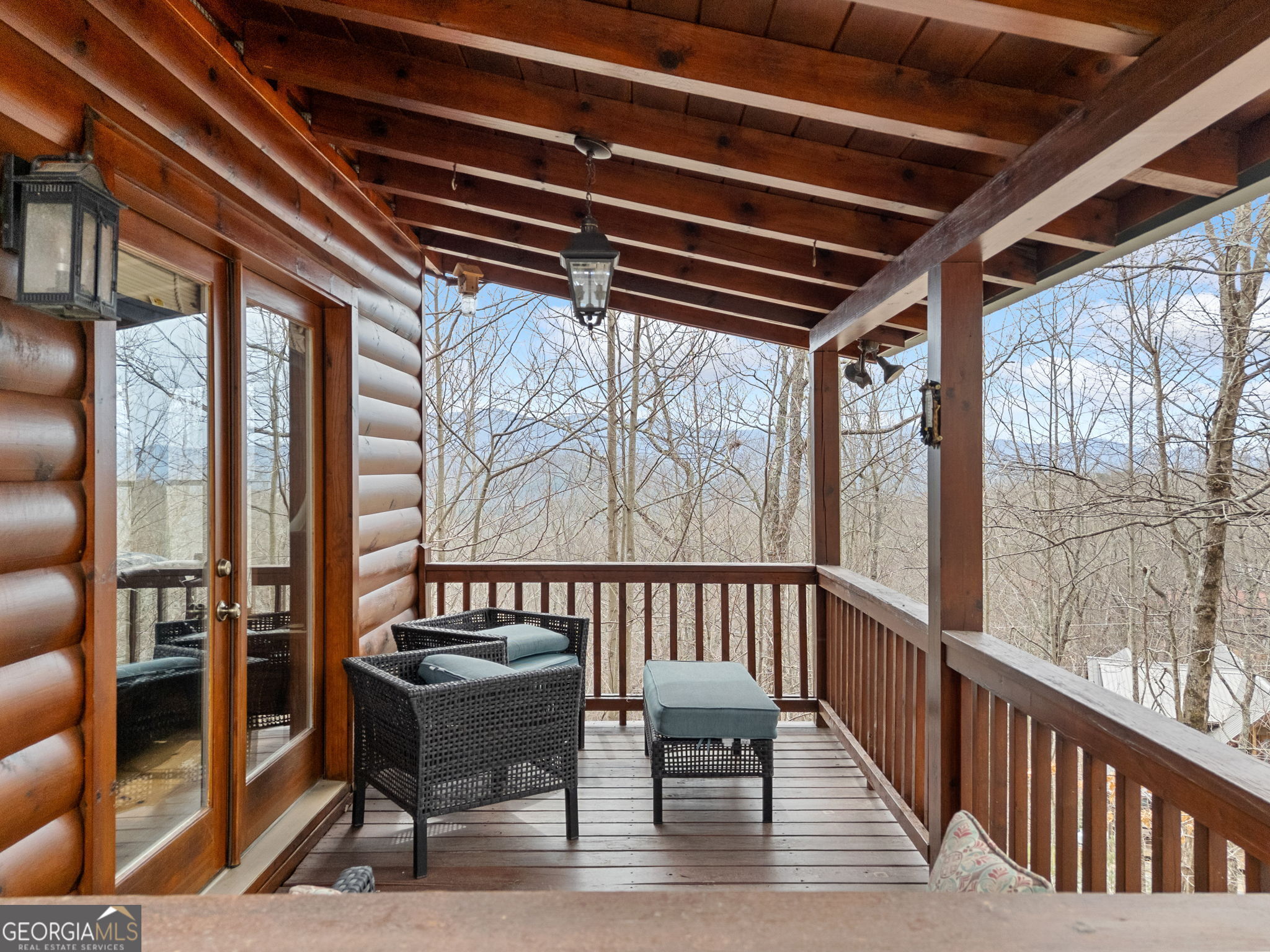 541 Little Bushy Head Road, Unit 271 Blue Ridge, GA 30513 - Photo 30 of 43 a view of a chairs and table in the balcony