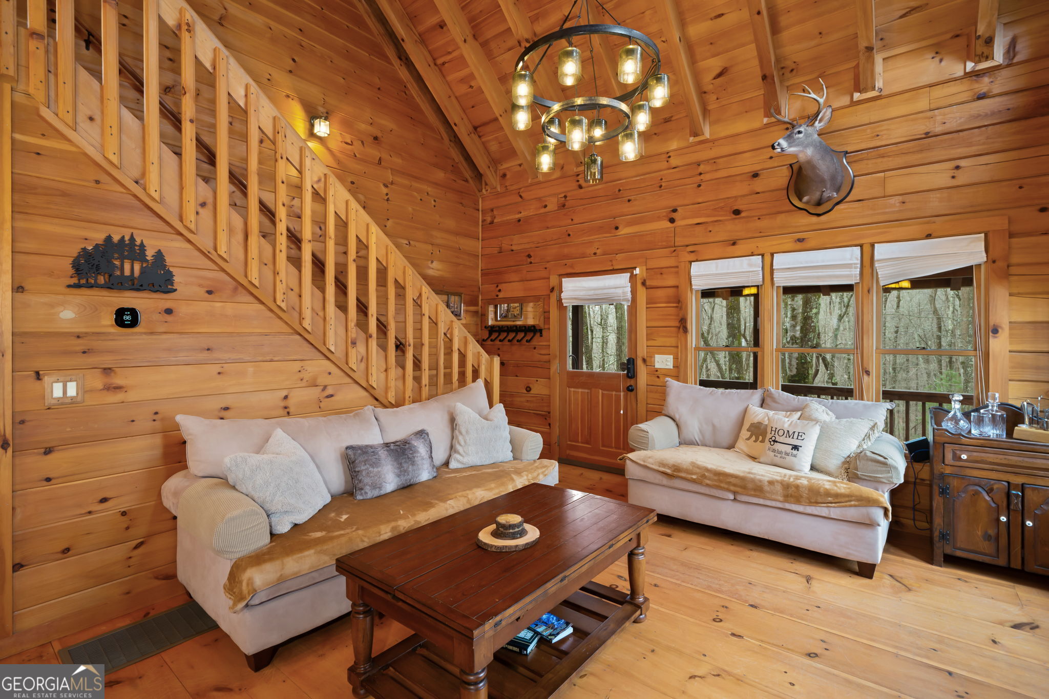 541 Little Bushy Head Road, Unit 271 Blue Ridge, GA 30513 - Photo 3 of 43 a living room with furniture ceiling fan and a rug