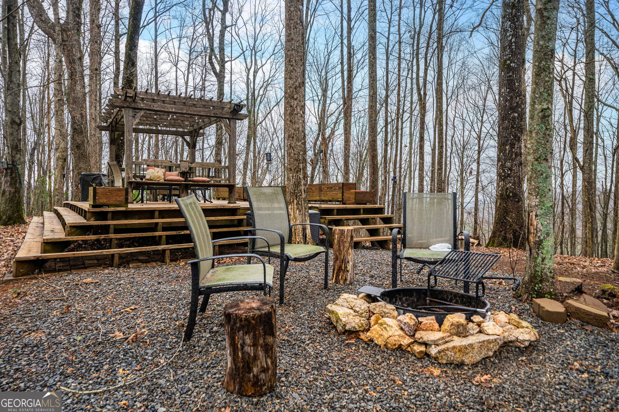541 Little Bushy Head Road, Unit 271 Blue Ridge, GA 30513 - Photo 36 of 43 a view of a chairs and table in backyard