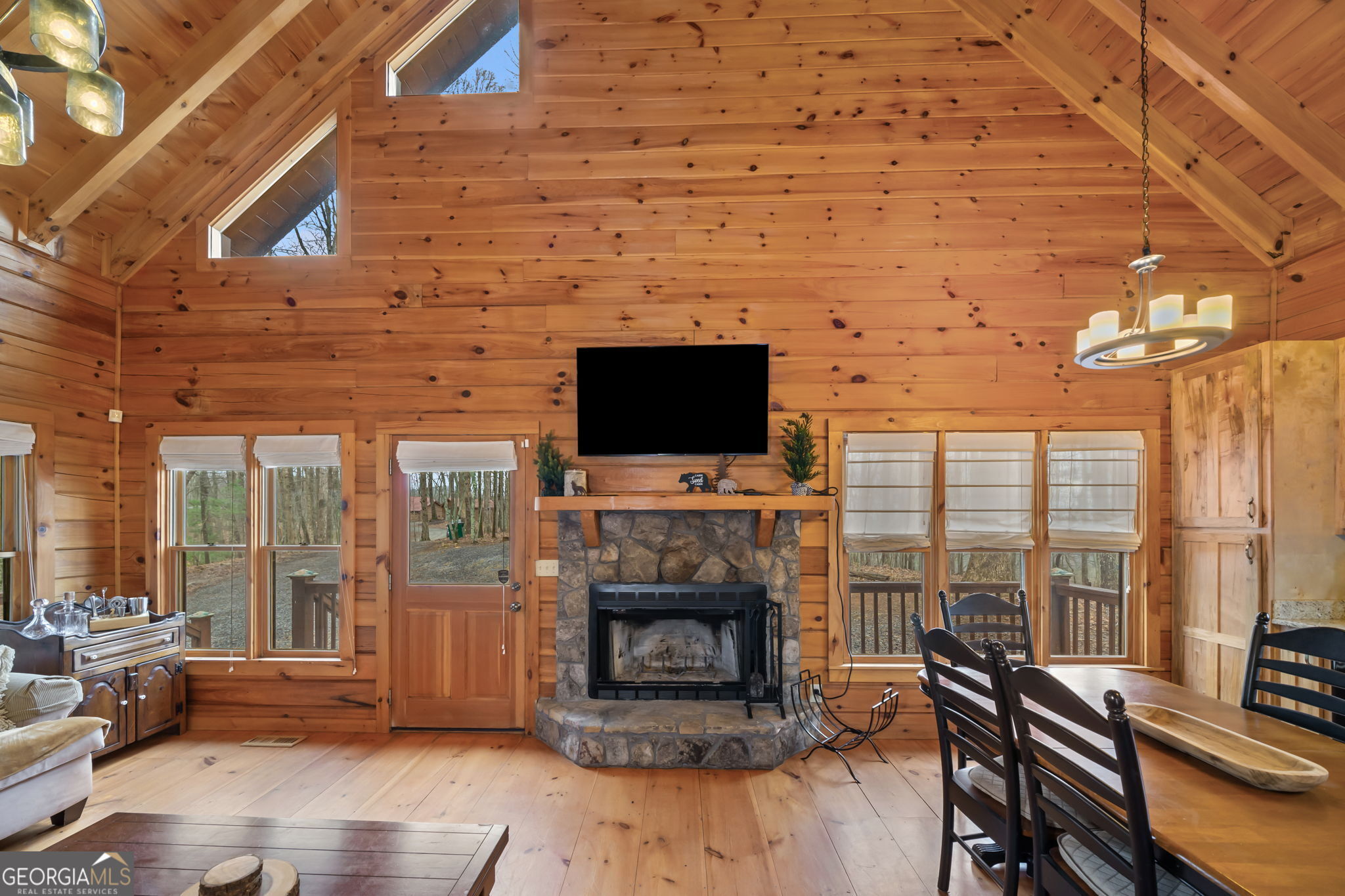 541 Little Bushy Head Road, Unit 271 Blue Ridge, GA 30513 - Photo 5 of 43 a living room with fireplace furniture and a flat screen tv