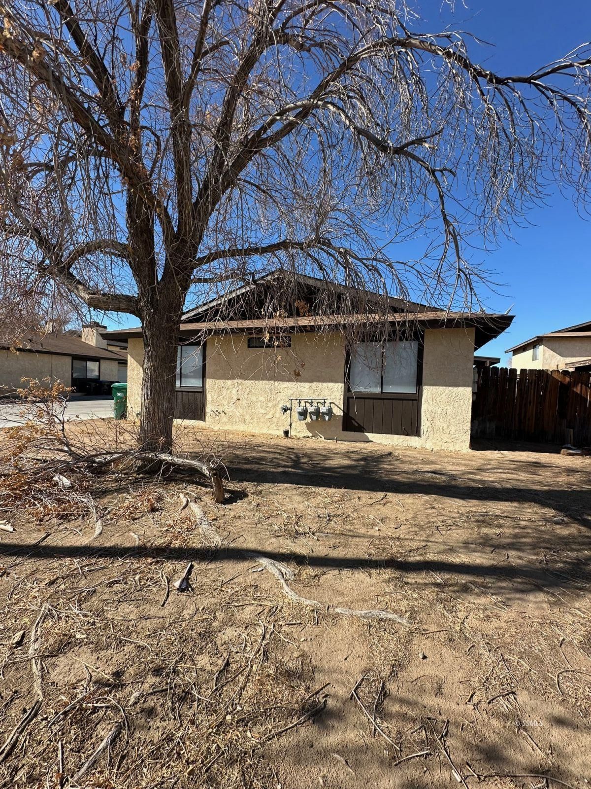 413 South Sunset Street Ridgecrest, CA 93555 - Photo 1 of 6 a view of a house with a yard