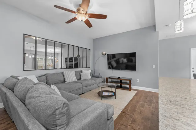 a living room with furniture and a flat screen tv