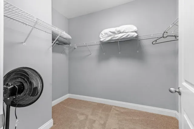 a close view of a utility room with racks on the wall