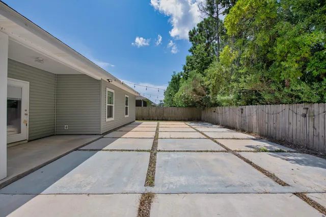 a backyard of a house with wooden floor