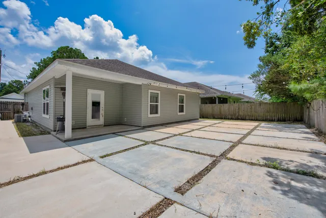 a front view of a house with a yard and a garage