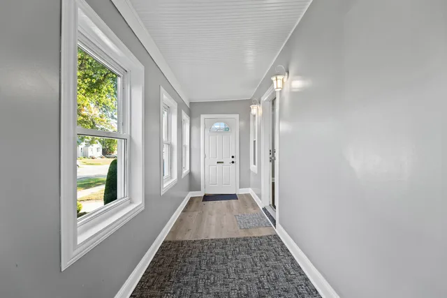 a view of a hallway with windows