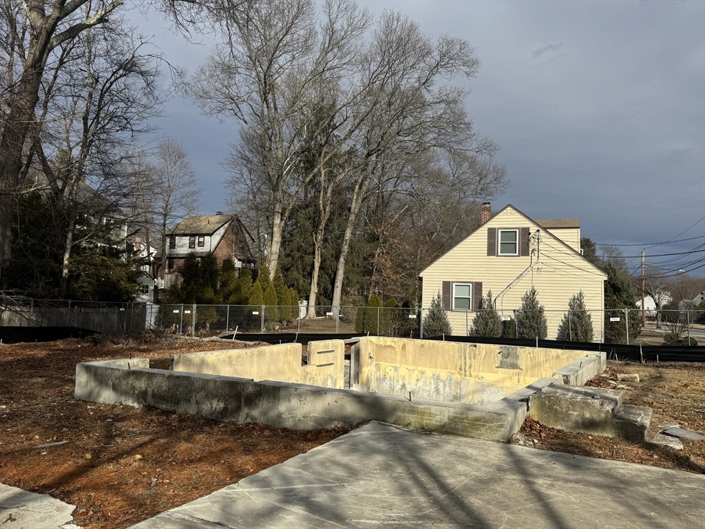 a view of a building with a yard