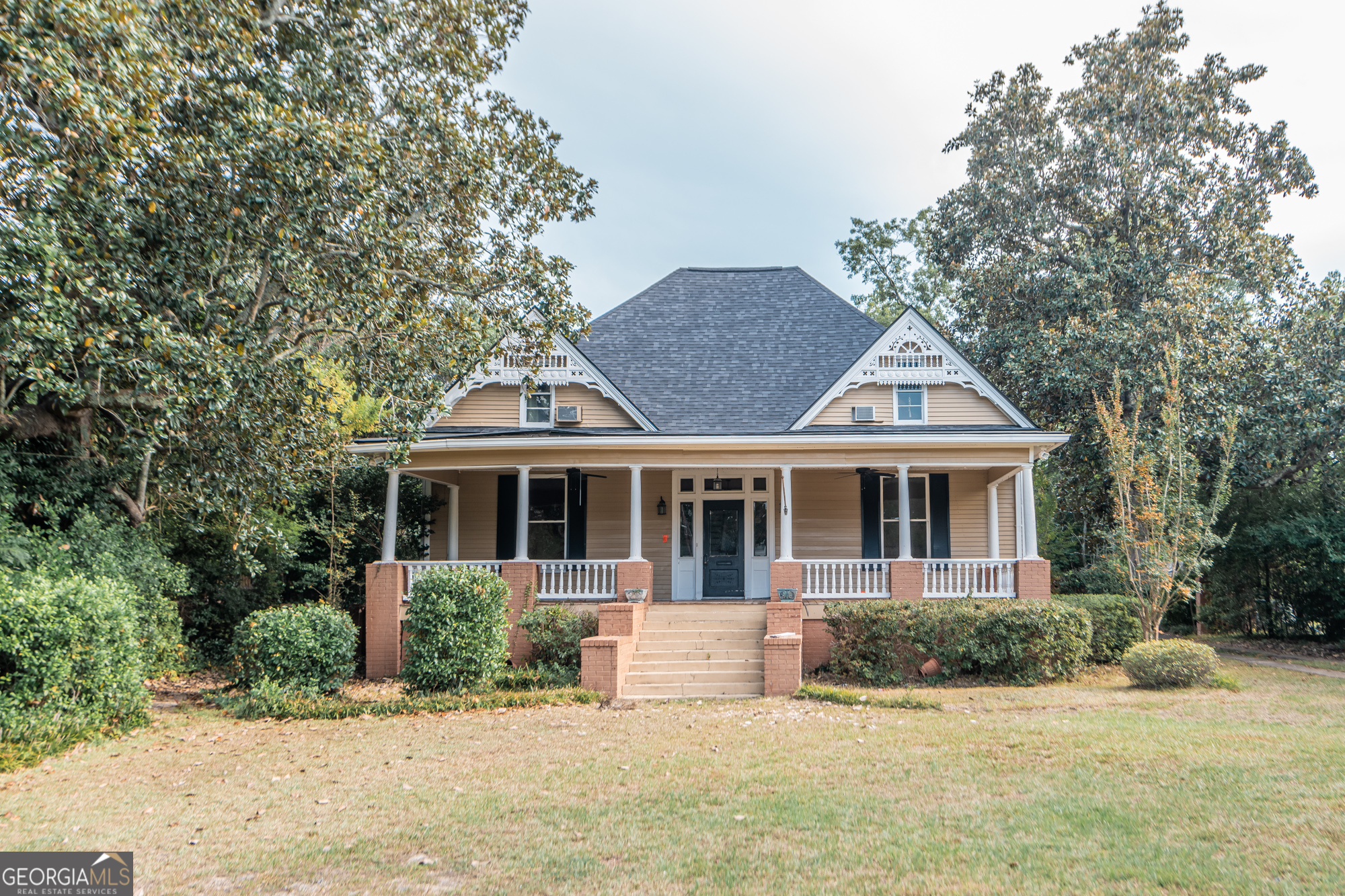 a front view of a house with a yard
