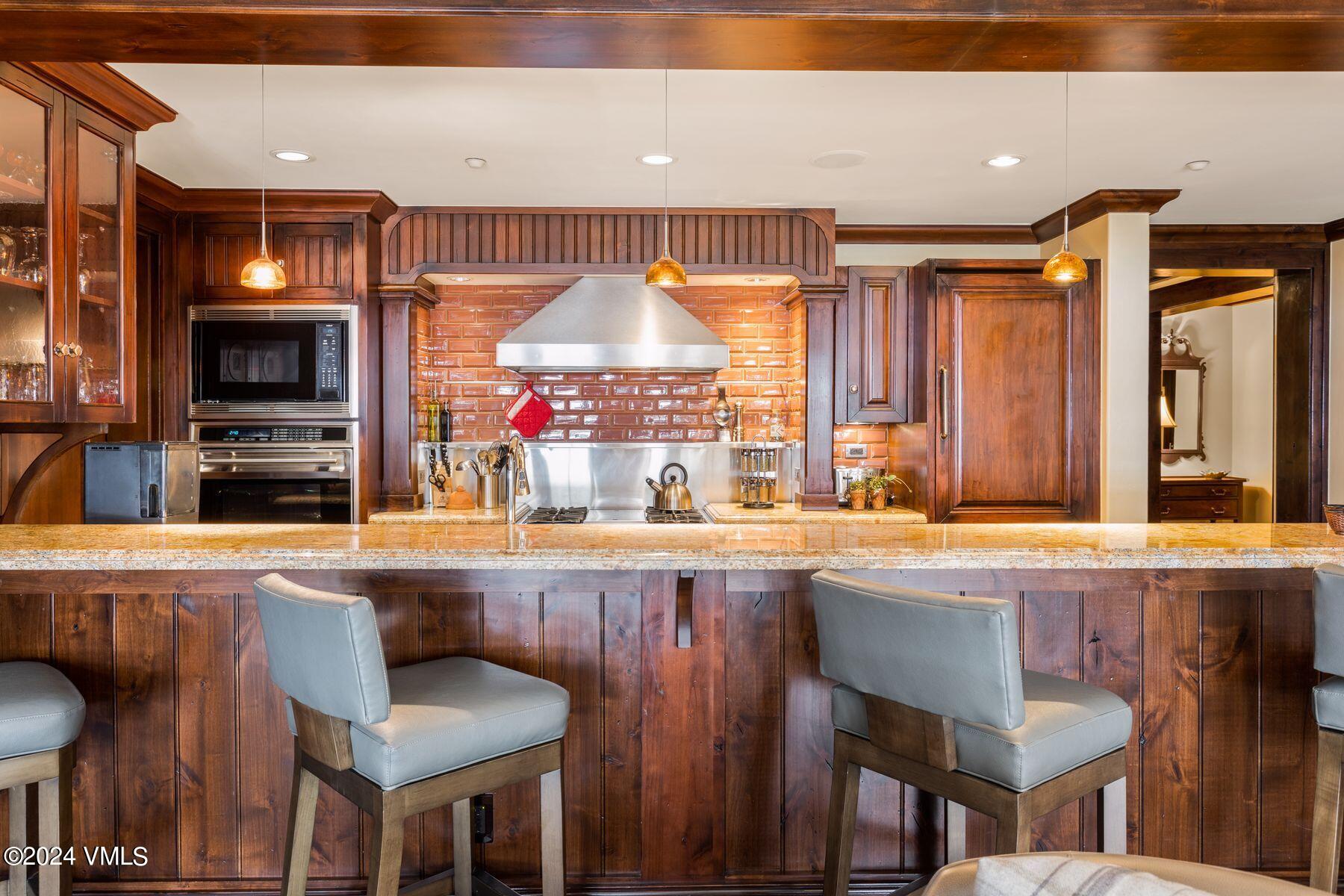 1 Willow Bridge Road, Unit 22D Vail, CO 81657 - Photo 11 of 39 a kitchen with a sink and a refrigerator