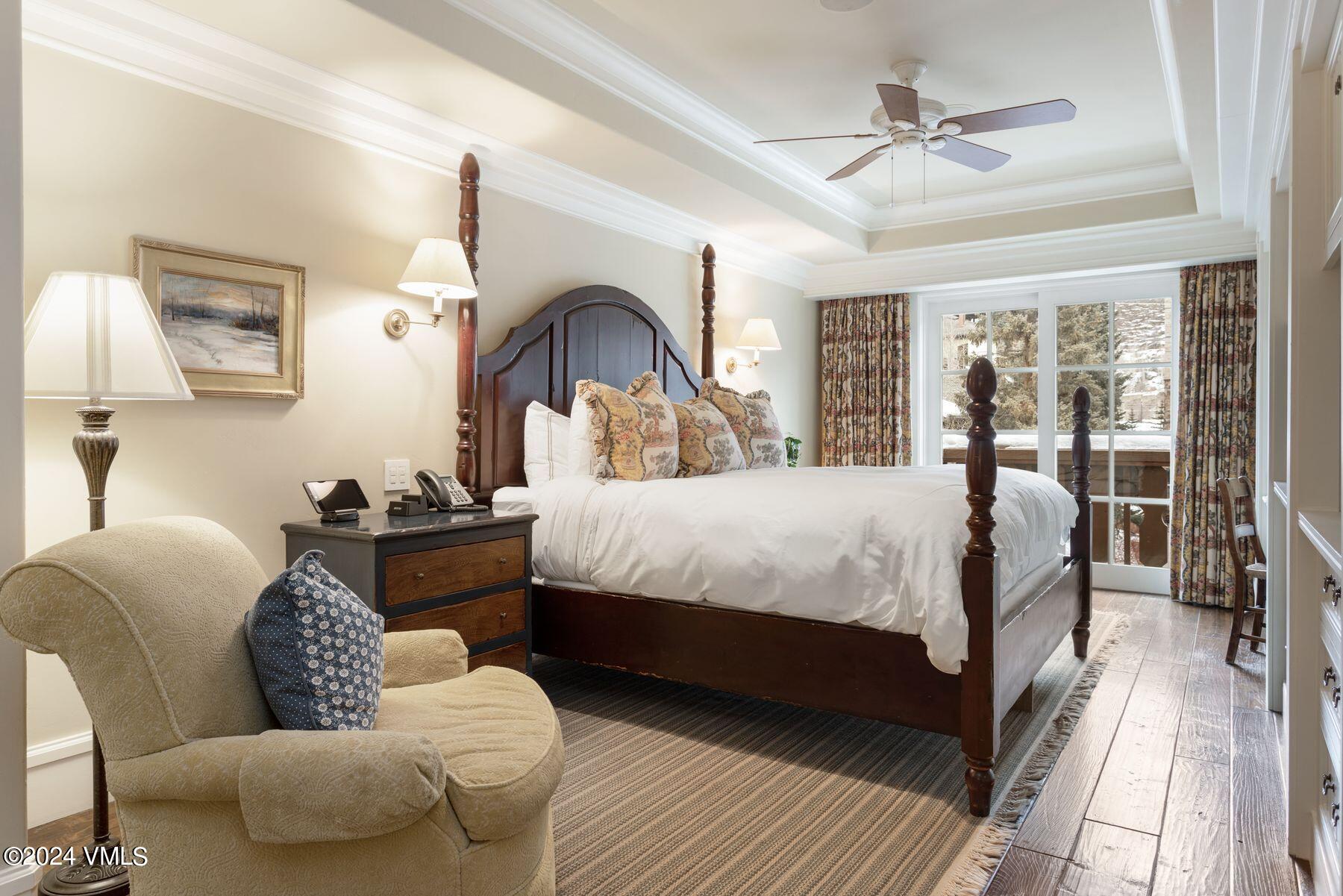1 Willow Bridge Road, Unit 22D Vail, CO 81657 - Photo 21 of 39 a bed room with a bed couch and a window