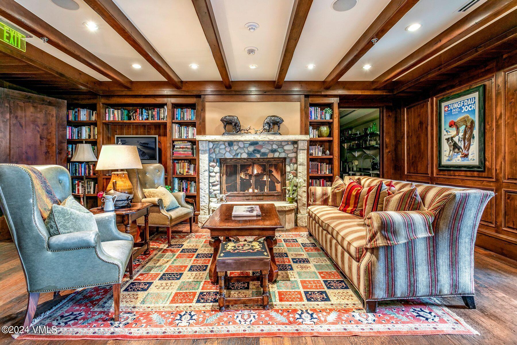 1 Willow Bridge Road, Unit 22D Vail, CO 81657 - Photo 35 of 39 a living room with furniture and a fireplace