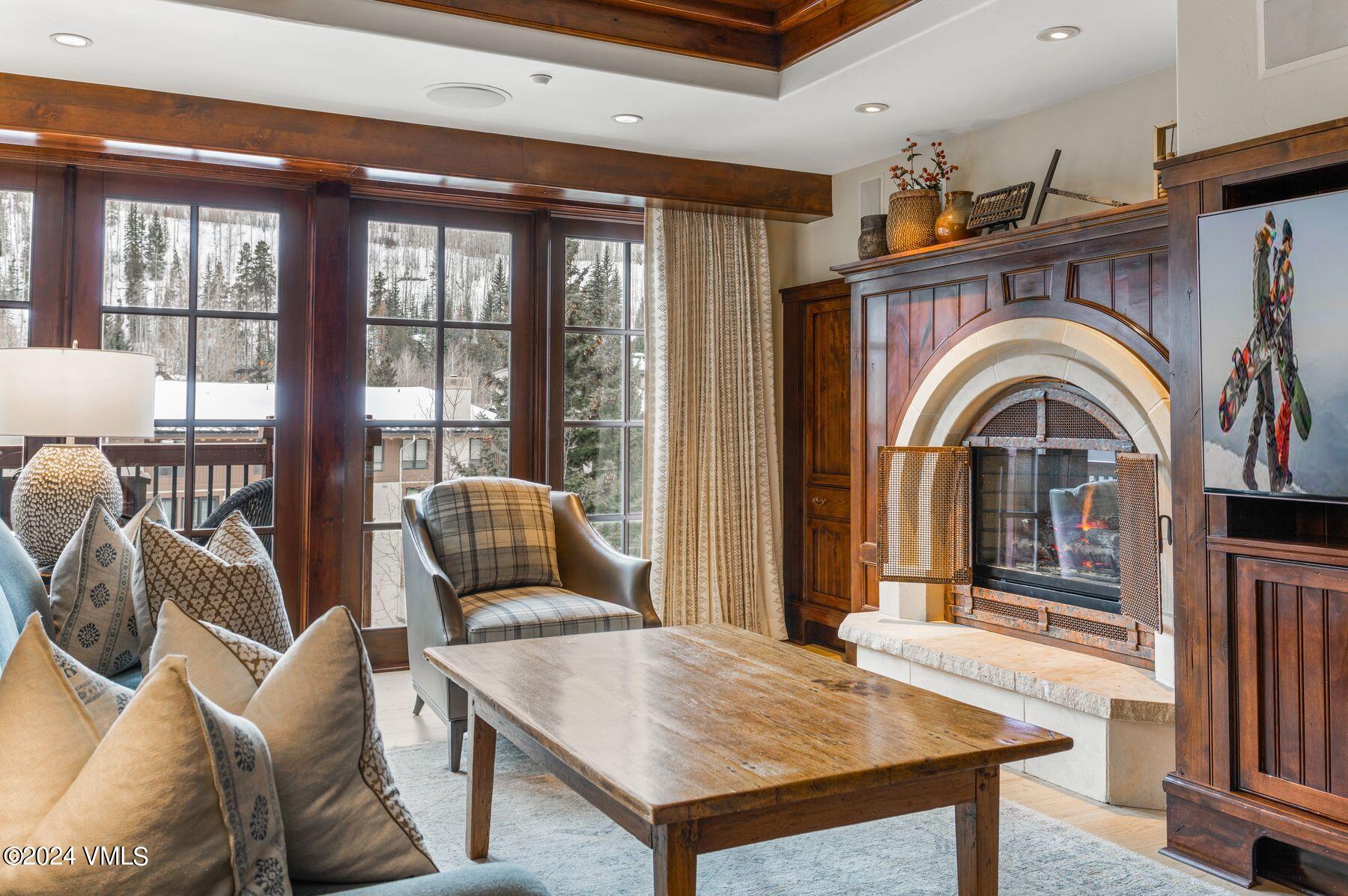 1 Willow Bridge Road, Unit 22D Vail, CO 81657 - Photo 8 of 39 a view of a livingroom with furniture window and wooden floor