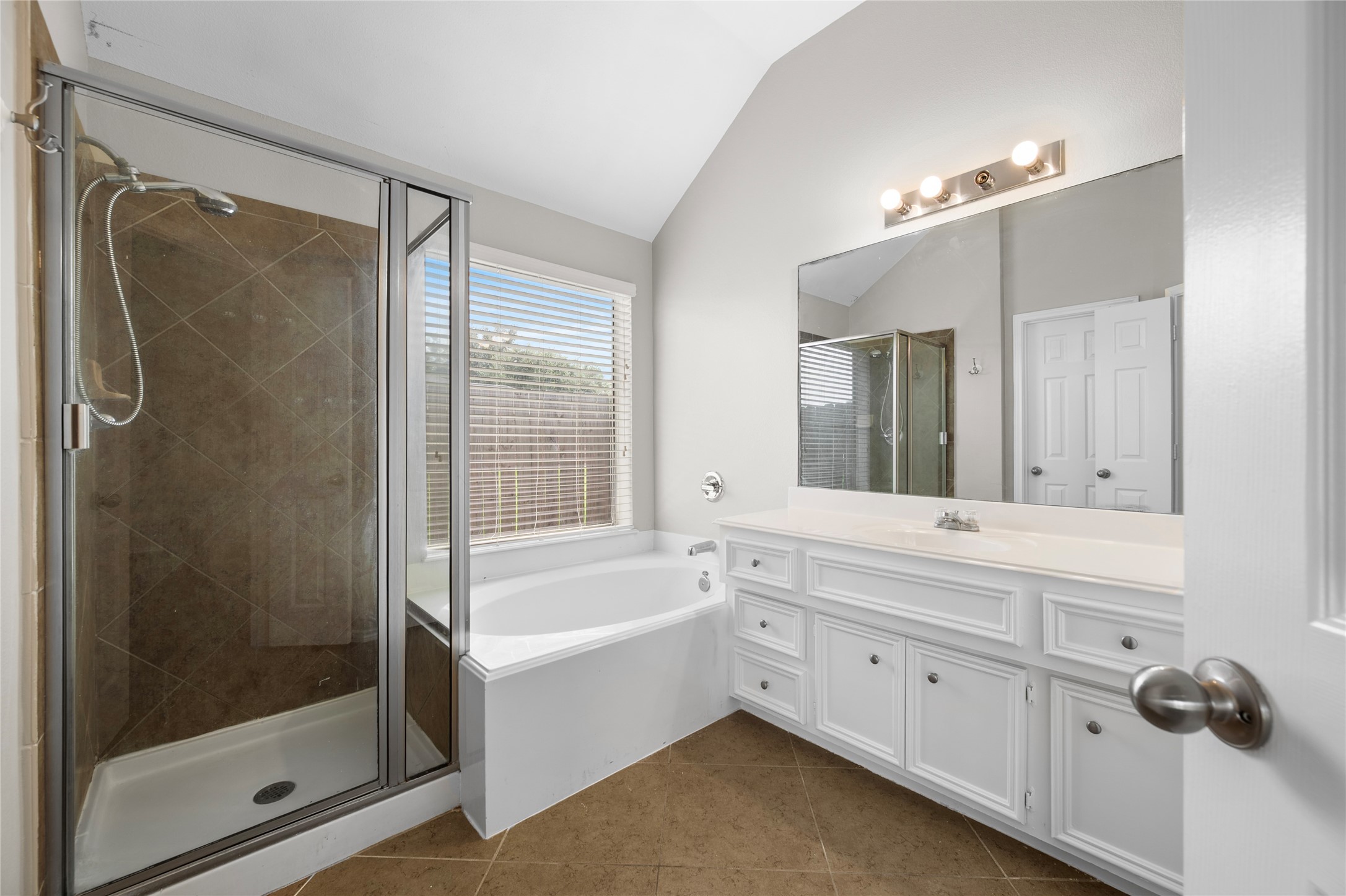 13134 Arden Ridge Lane Houston, TX 77014 - Photo 15 of 25 Primary bathroom with separate shower and soaking tub.