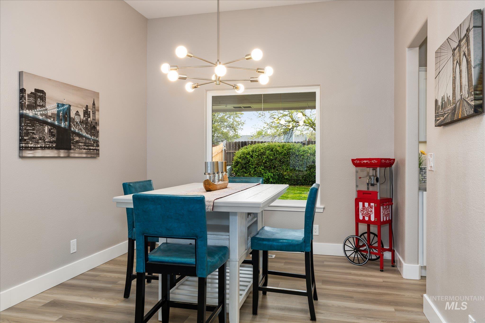 2250 North Amethyst Avenue Meridian, ID 83646 - Photo 11 of 50 Dining room featuring suspended lighting and light wood finished floors