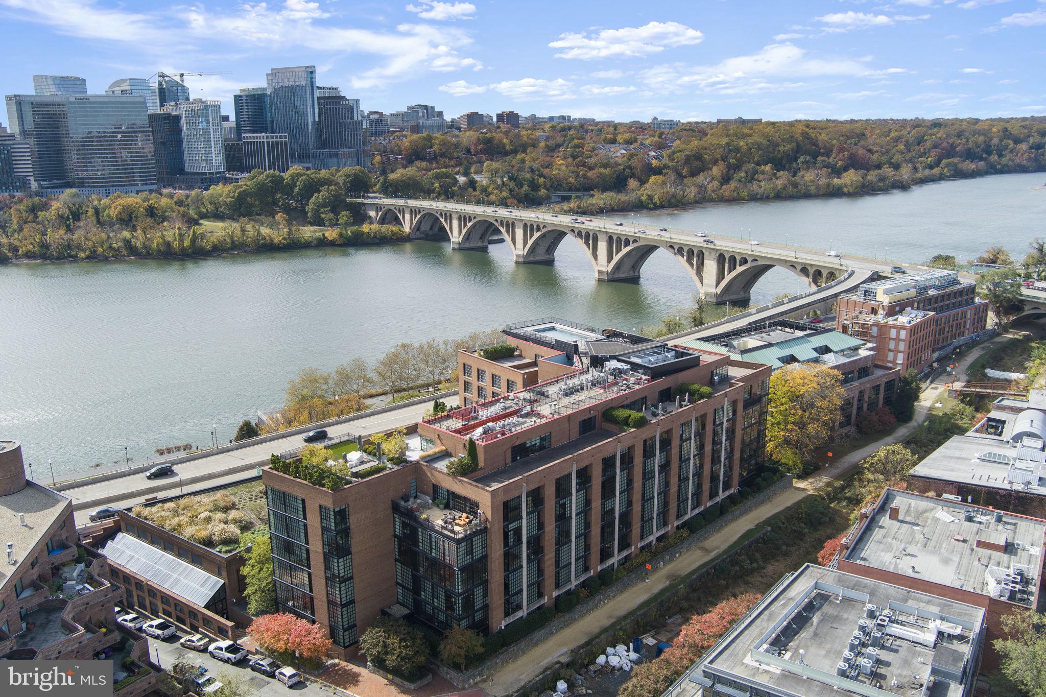 an aerial view of a house with a lake view