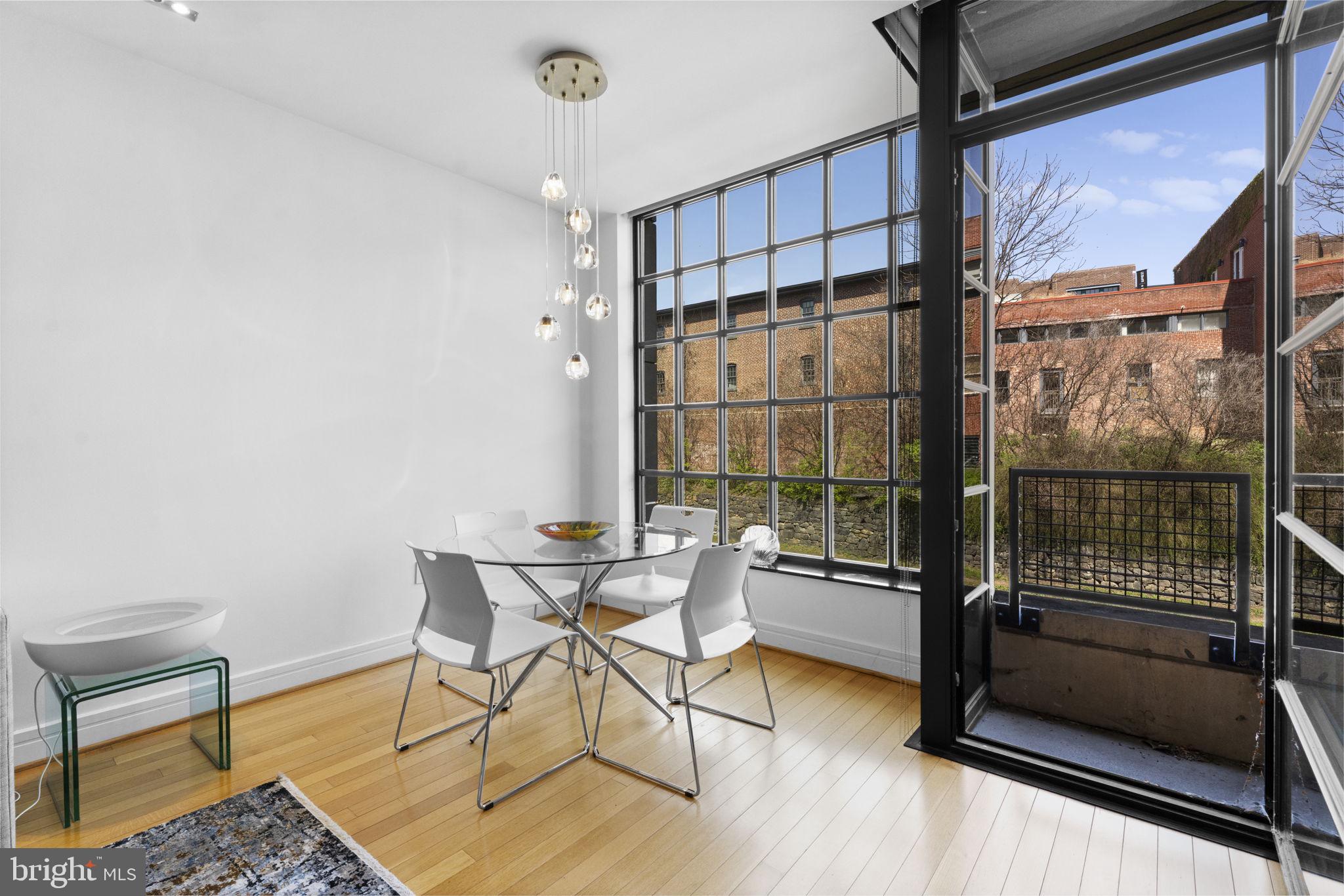 3303 Water Street Northwest, Unit 4B Washington, DC 20007 - Photo 18 of 66 a work room with wooden floor and furniture